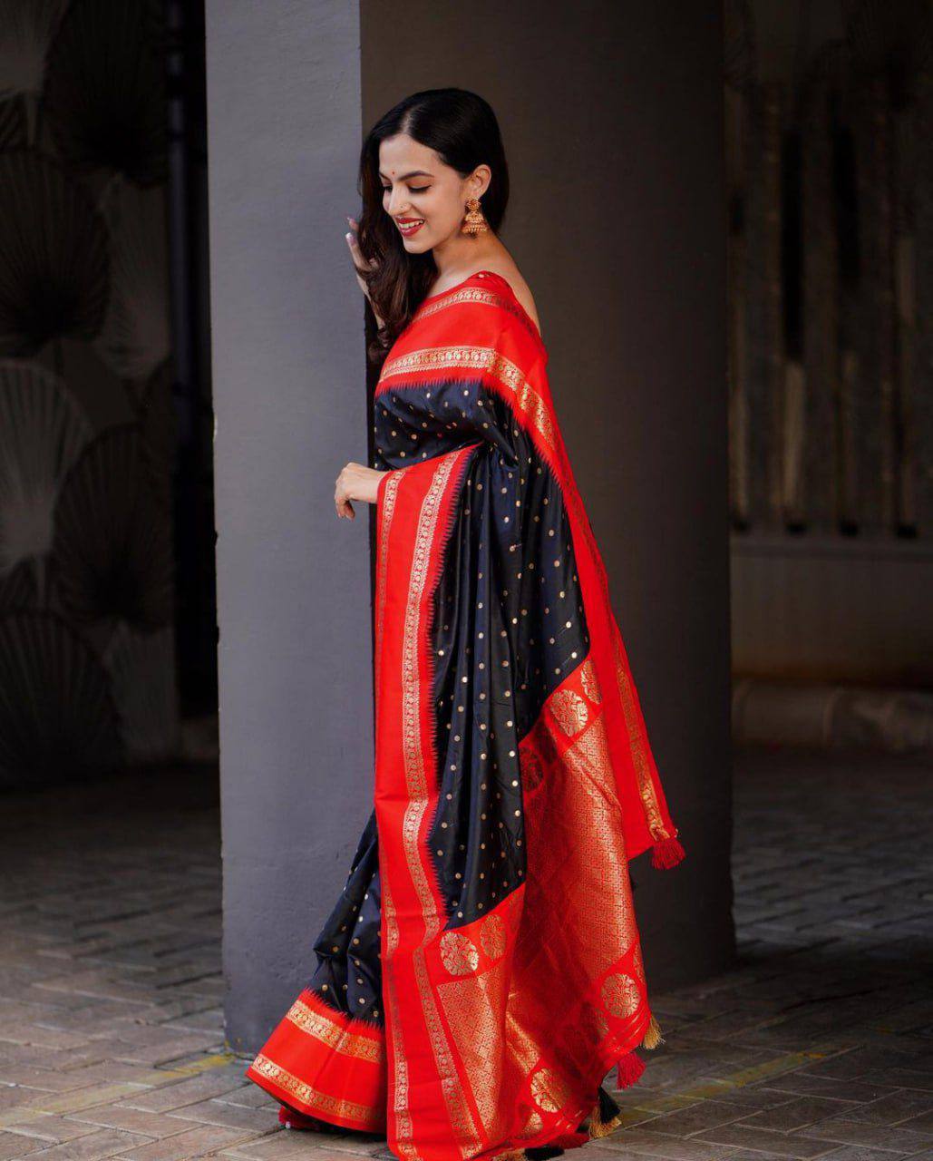 Beautiful black with golden polka motifs and a rich red border with golden zari work Saree with All-Over Jacquard Work
