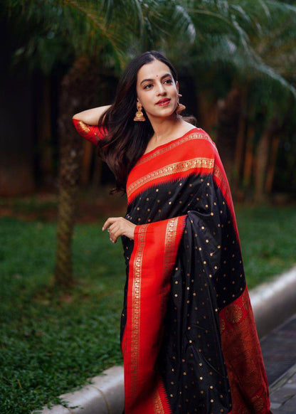 Beautiful black with golden polka motifs and a rich red border with golden zari work Saree with All-Over Jacquard Work