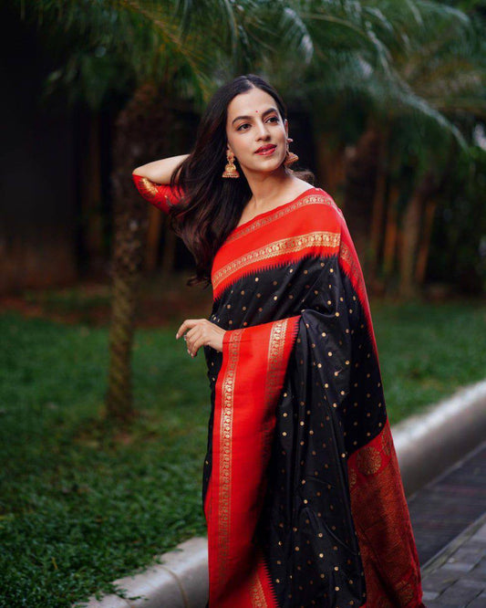 Beautiful black with golden polka motifs and a rich red border with golden zari work Saree with All-Over Jacquard Work