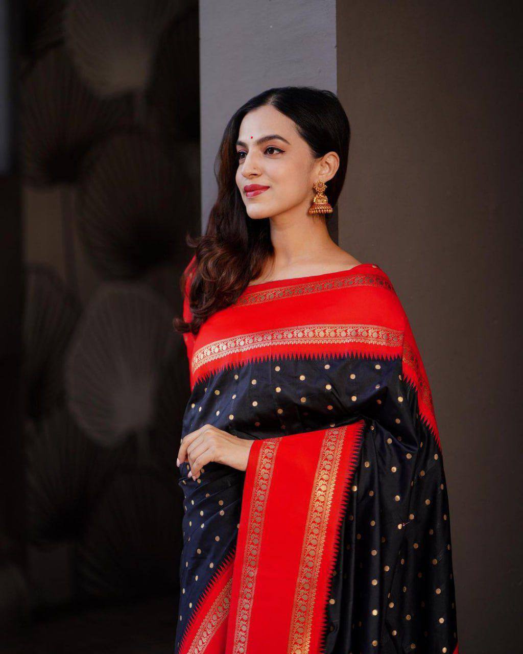 Beautiful black with golden polka motifs and a rich red border with golden zari work Saree with All-Over Jacquard Work
