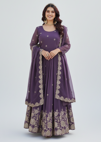 Woman wearing a purple traditional outfit with gold embroidery on a white background